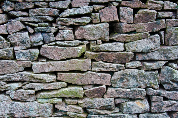 Primer plano en una pared de piedra seca en la campiña de yorkshire, Reino Unido. Patrón materiales de construcción —  Fotos de Stock