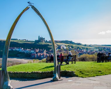 View of The whale bones, Whitby town symbol with abbey in background clipart