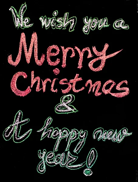 We wish you a Merry Christmas and a happy new year, hand writing with chalk on blackboard, vintage concept — Stock Photo, Image