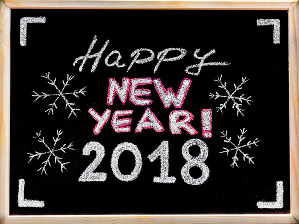 Happy new year 2018, hand writing with chalk on blackboard, vintage concept