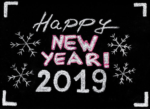 Happy new year 2019, hand writing with chalk on blackboard, vintage concept