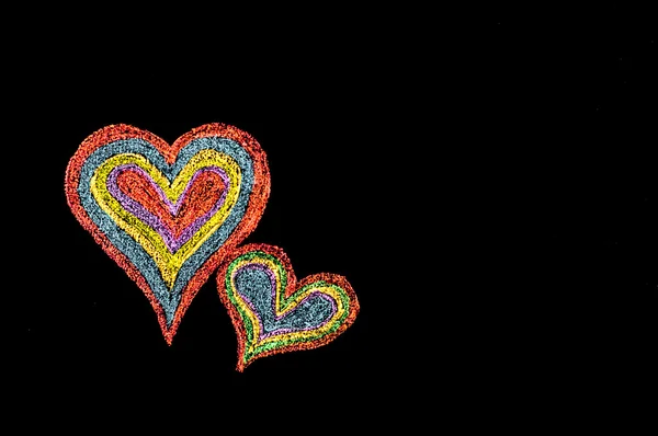 Imagen conceptual del amor, con dos corazones vivos en forma de color uno cerca del otro — Foto de Stock