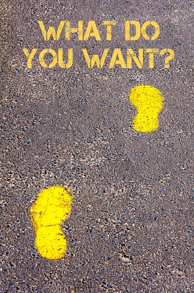 Yellow footsteps on sidewalk towards What do you want message — Stock Photo, Image