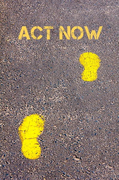 Yellow footsteps on sidewalk towards Act Now message — Stock Photo, Image