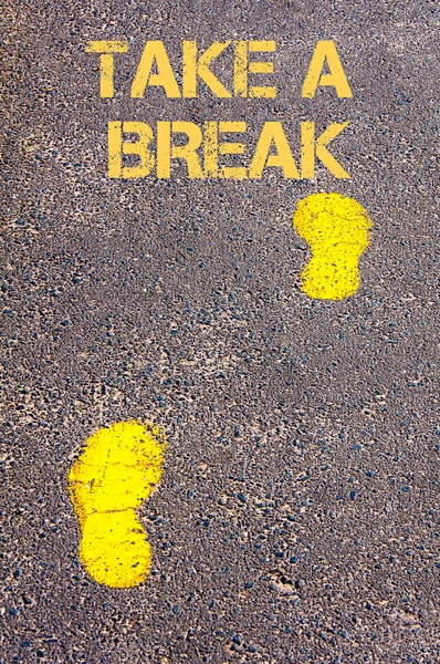 Yellow footsteps on sidewalk towards Take a break message — Stock Photo, Image