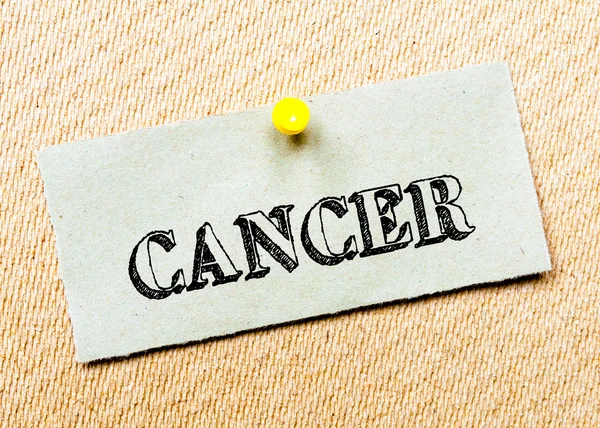 Recycled paper note pinned on cork board. Cancer Message. Concept Image — Stock Photo, Image