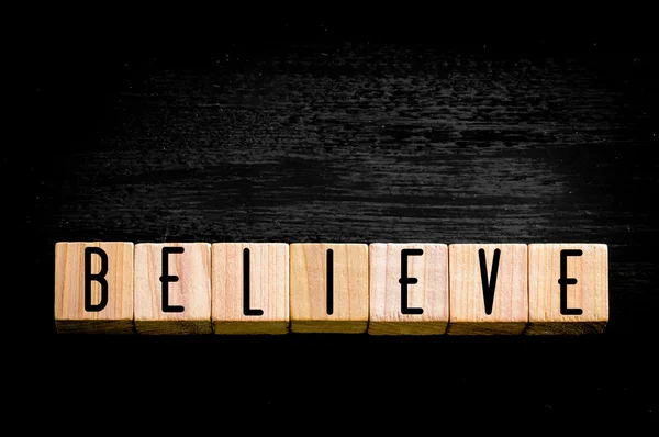 Word Believe isolated on black background — Stock Photo, Image