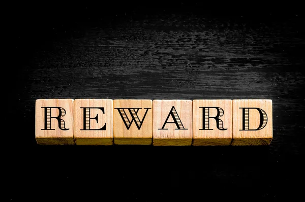 Word Reward isolated on black background — Stock Photo, Image