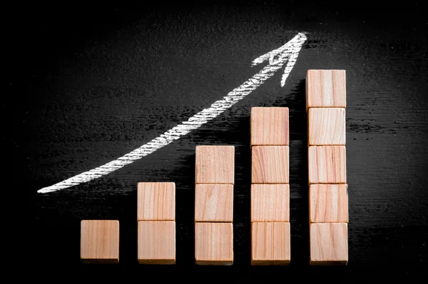 Ascending arrow above bar graph — Stock Photo, Image