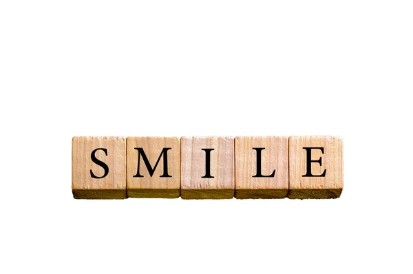 Palavra SMILE isolado em fundo branco com espaço de cópia — Fotografia de Stock