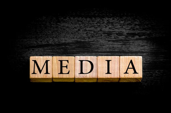 Word MEDIA isolated on black background with copy space — Stock Photo, Image