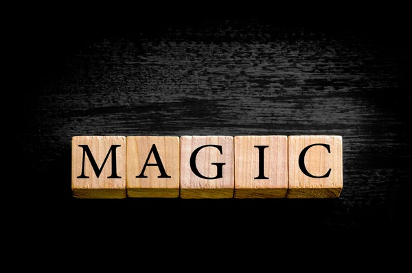 Word MAGIC isolated on black background with copy space — Stock Photo, Image