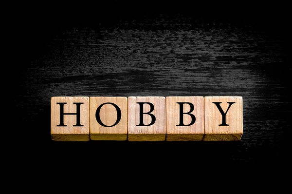 Słowo Hobby na białym tle na czarnym tle z kopii przestrzeni — Zdjęcie stockowe