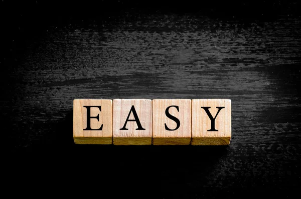 Word EASY isolated on black background with copy space — Stock Photo, Image