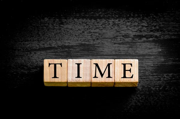 Word TIME isolated on black background with copy space — Stock Photo, Image