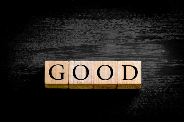 Word GOOD isolated on black background with copy space — Stock Photo, Image