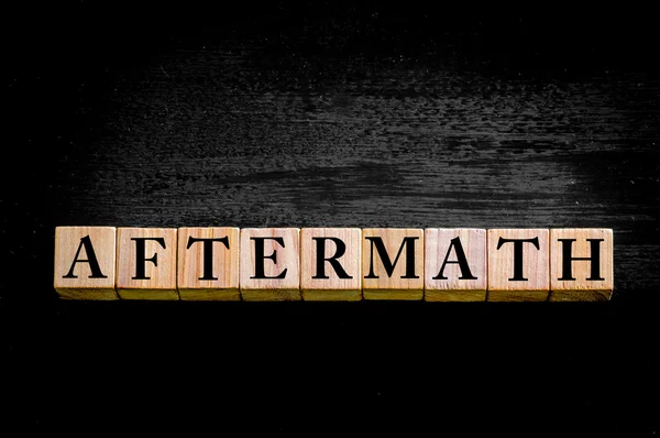 Word AFTERMATH isolated on black background — Stock Photo, Image