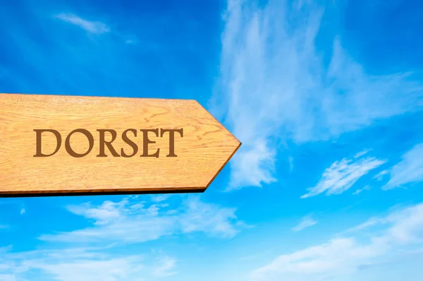 Wooden arrow sign pointing destination DORSET, ENGLAND — Stock Photo, Image