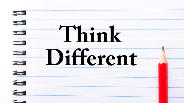 Think Different Text written on notebook page
