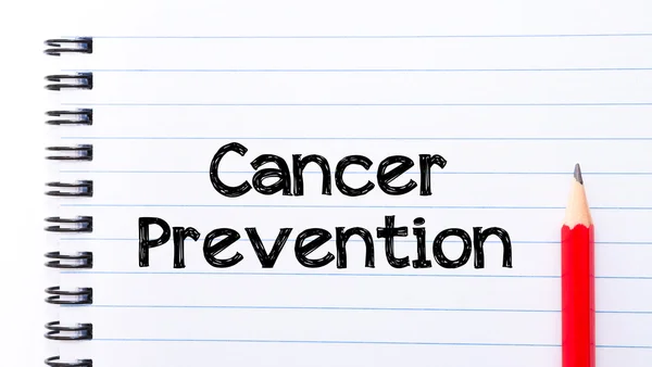 Cancer Prevention Text written on notebook page