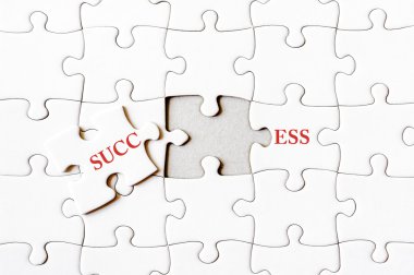 Missing jigsaw puzzle piece completing word SUCCESS clipart