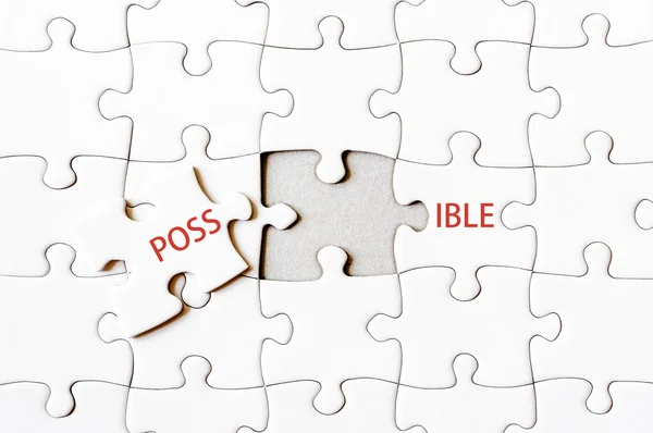Peça de quebra-cabeça em falta completando a palavra POSSIBLE — Fotografia de Stock