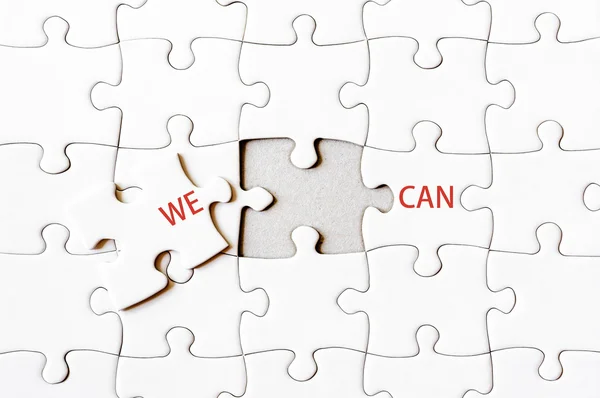 Missing jigsaw puzzle piece completing words WE CAN — Stock Photo, Image