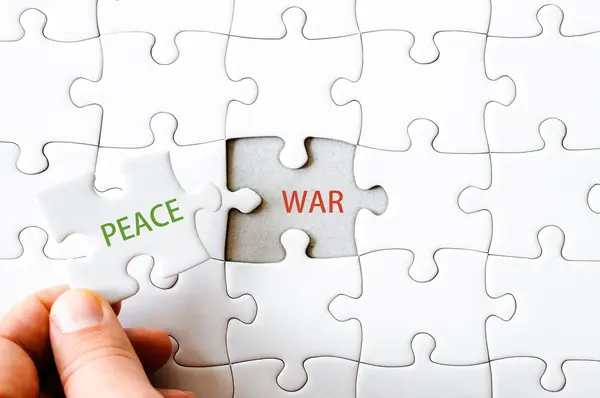Missing jigsaw puzzle piece with word PEACE — Stock Photo, Image