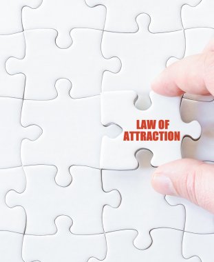 Last puzzle piece with words  LAW OF ATTRACTION clipart