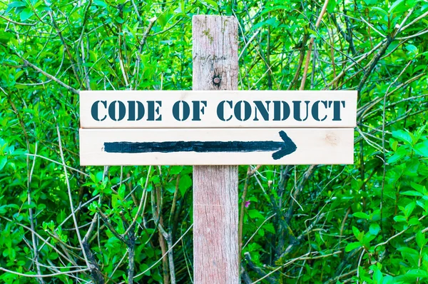 CODE of CONDUCT Directional sign — стоковое фото