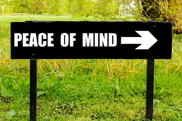 PEACE OF MIND written on directional black metal sign — Stock Photo, Image