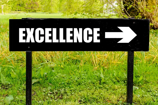 EXCELLENCE written on directional black metal sign — Stock Photo, Image