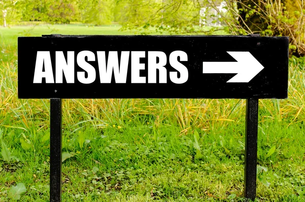 ANSWERS written on directional black metal sign — Stock Photo, Image