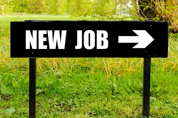 NEW JOB written on directional black metal sign — Stock Photo, Image