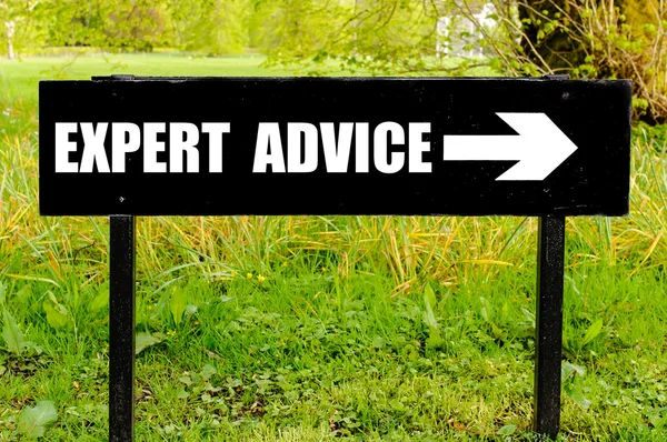 EXPERT ADVICE written on directional black metal sign — Stock Photo, Image