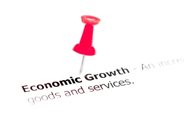 词经济增长寄托在白皮书与红色图钉 — 图库照片