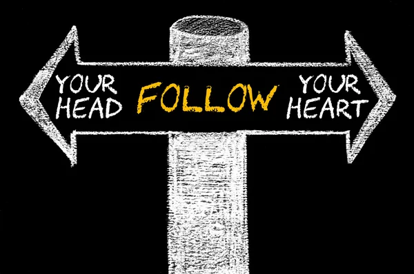 Opposite arrows with Follow Your Head or Your Heart — Stock Photo, Image