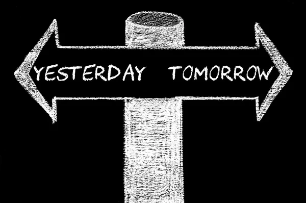 Opposite arrows with Yesterday versus Tomorrow — Stock Photo, Image