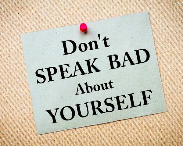 Don 't Speak Bad About Yourself Message written on paper note — стоковое фото