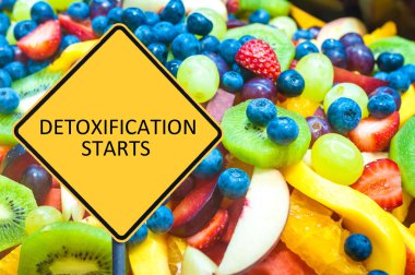 Yellow roadsign with message DETOXIFICATION STARTS