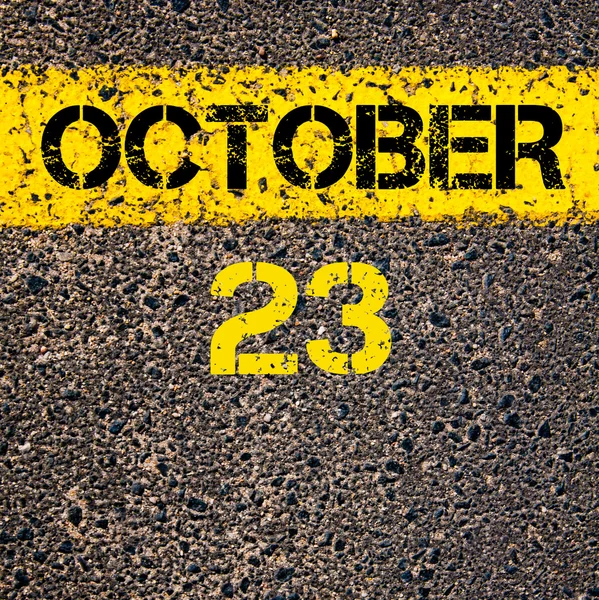23 oktober kalenderdag över vägmarkering gul måla linje — Stockfoto