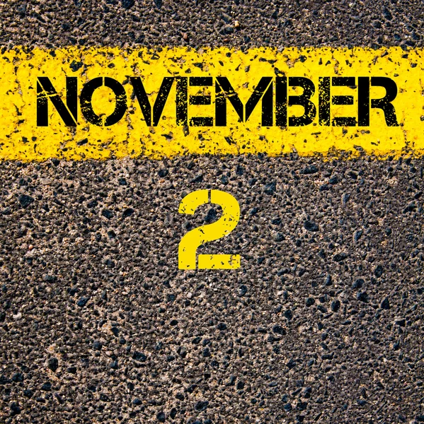 2 November calendar day over road marking yellow paint line — Stock Photo, Image