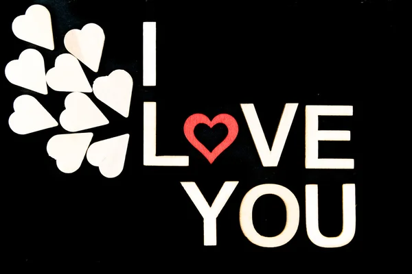 Slova I Love You vytvořili dřeva písmen nad vinobraní tabuli — Stock fotografie