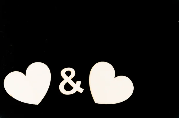 Pair of heart shapes symbols isolated on black, available copy space, love concept — Stock Photo, Image