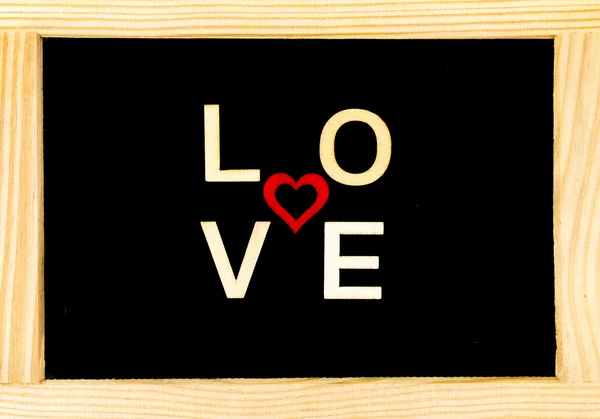 Vintage bord geïsoleerd op wit met woord liefde gemaakt van hout brieven — Stockfoto