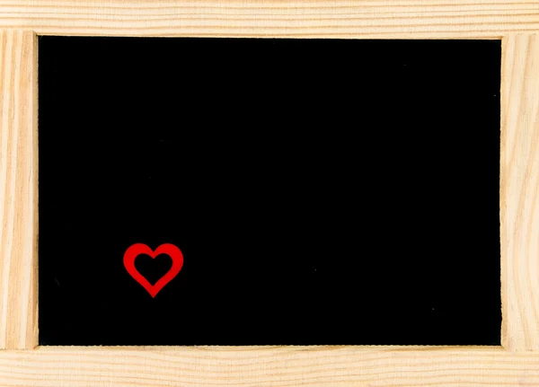 Wooden frame vintage chalkboard with red heart shape symbol — Stock Photo, Image