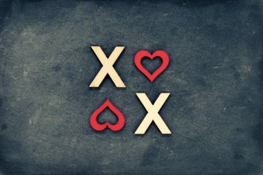 Vintage kara tahta ahşap harflerini oluşturulan metin Xoxo (öper ve hugs) ile