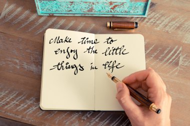Motivational concept with handwritten text MAKE TIME TO ENJOY THE LITTLE THINGS IN LIFE
