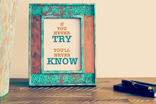 Motivational quote written on vintage photo frame IF YOU NEVER TRY YOU'LL NEVER KNOW — Stock fotografie