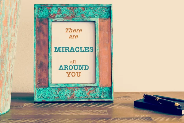 Motivational quote written on vintage photo frame THERE ARE MIRACLES ALL AROUND YOU — Stockfoto